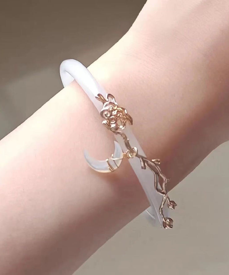 Elegant White Alloy Coloured Glaze Moon Bangle