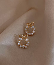 Fashion Gold Copper Alloy Pearl Bow Stud Earrings