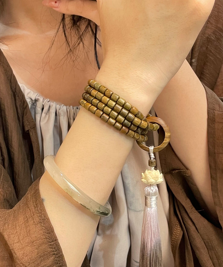 Retro Green Sandalwood Barrel Bead Lotus Tassel Bracelet