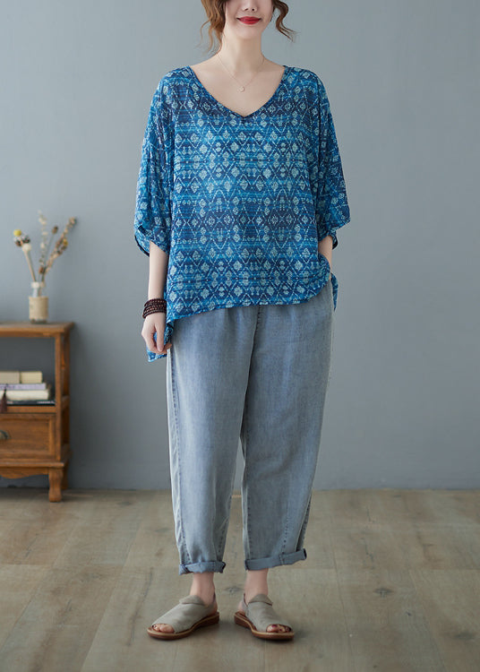 Lose blaue Bluse mit V-Ausschnitt, niedrigem, hohem Design und halblangem Ärmel