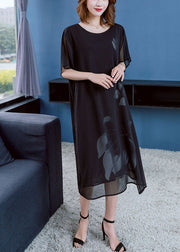 Moderne schwarze O-Neck-Blumendruck-drapierende Chiffon-Kleider mit kurzen Ärmeln