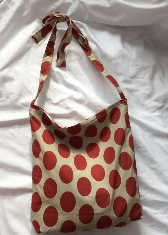 Moderne Kuriertasche aus orangefarbenem Punktdruck-Segeltuch