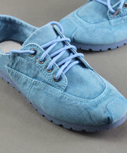 Flache Schuhe aus blauem Baumwollgewebe für Damen mit Kreuzriemen